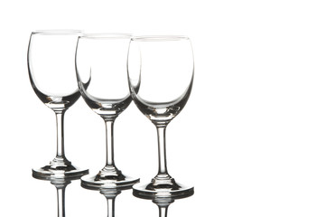 Three empty wine glasses on white background