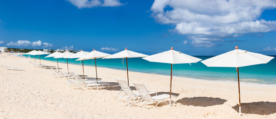 Chairs and umbrellas on tropical beach