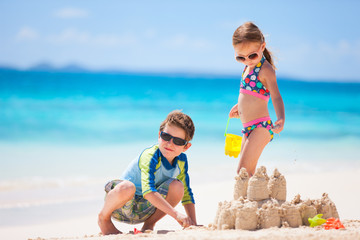 Two kids playing at beach