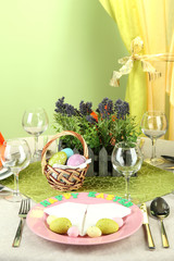 Easter table setting on color background