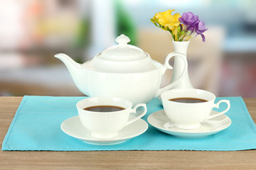 Beautiful tea service on wooden table