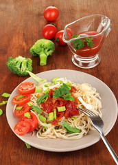 Tasty spaghetti with sauce and vegetables