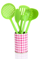 Green plastic kitchen utensil isolated on white