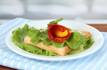 Salami rolls with paprika pieces inside,