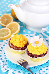 Beautiful lemon cupcakes and flavored tea