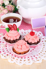 Beautiful strawberry cupcakes and flavored tea