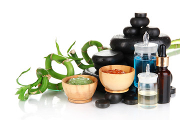 Spas composition with oils and spa stones isolated on white