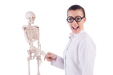 Doctor with skeleton on white