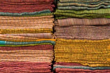 Heap of cloth fabrics at a local market in India.