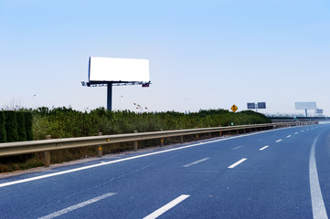 Commercial blank billboard besides the high-way