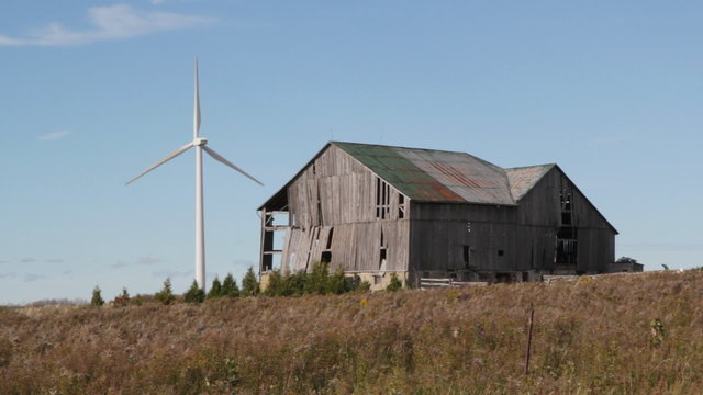 Modern windmill. Old barn. Ontario.