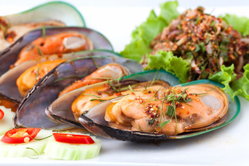 cooked shellfish with spicy salad