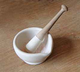 A Pestle and Mortar with Ground Up Spices.