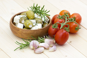 feta cheese with olives, tomatoes, garlic and herbs