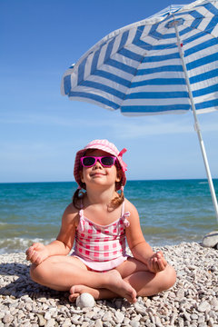 happy little girl on beach
