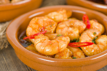 Gambas Pil Pil (Sizzling prawns with chili and garlic). Tapas.