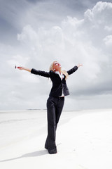 happy business woman on the ocean coast