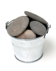 pile of pebles in a metal bucket © Diana Taliun