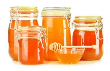 Composition with jar of honey isolated on white
