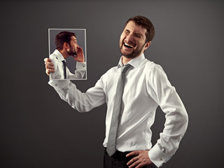 man laughing at a joke