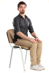 Young caucasian handsome man sitting on the chair
