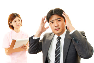 頭痛を訴える患者