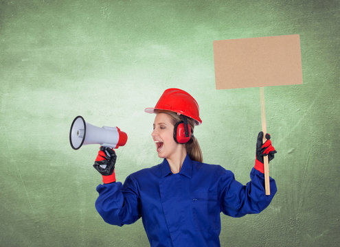 Industrial worker woman with a megaphone and a poster