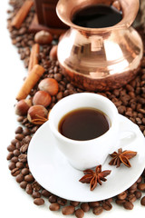 Cup and pot of coffee and coffee beans, isolated on white