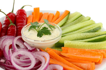 Assorted raw vegetables sticks in plate close up