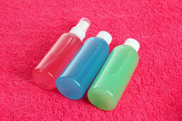 Hotel cosmetics kit on pink towel