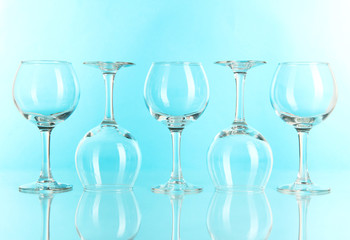 Glasses on light blue background
