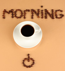 Cup of strong coffee on beige background