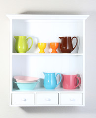 Kitchen utensils on beautiful white shelves