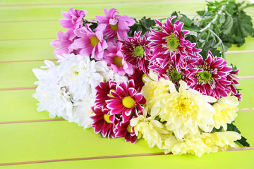Bouquet of beautiful chrysanthemums on table close-up
