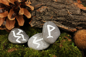 Fortune telling  with symbols on stones close up