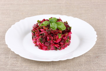 Vinaigrette Russian salad with beets on white plate