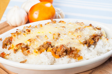 chili con carne with melted cheese on top