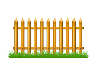 Wooden fence standing in grass