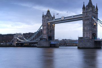 Fototapeta na wymiar Long exposure of Tower Bridge in London during twilight blue hou