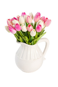 white tulips in a vase on a white background.