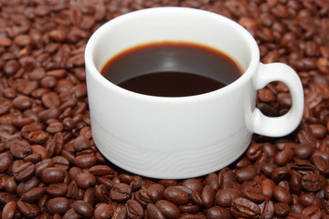 cup of coffee with coffee beans