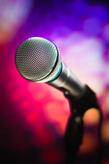 microphone against purple background