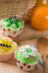 beautiful cup cakes muffins with baking background