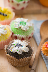 beautiful cup cakes muffins with baking background