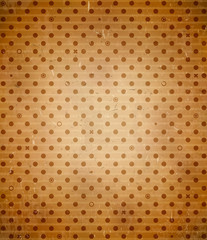 Scratched cardboard with polka dot pattern © swillklitch