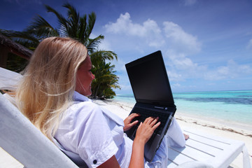 tropical business woman with laptop