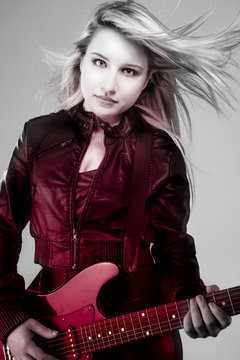 young beautiful blonde with red light, electric guitar