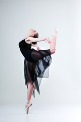 Beautiful ballet-dancer, modern style dancer posing on studio © Pandorabox