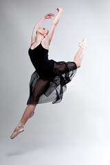 Beautiful ballet-dancer, modern style dancer posing on studio © Pandorabox