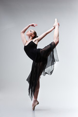 Beautiful ballet-dancer, modern style dancer posing on studio © Pandorabox